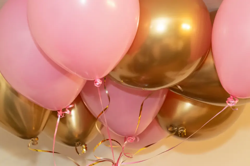 Pink and gold balloons at a birthday party